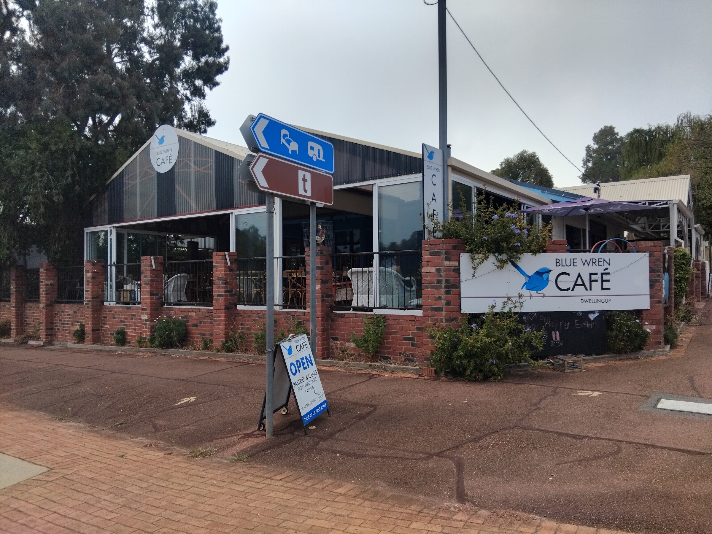 The Blue Wren Café shopfront on McLarty Street, with the painted sign and the A-frame on the footpath